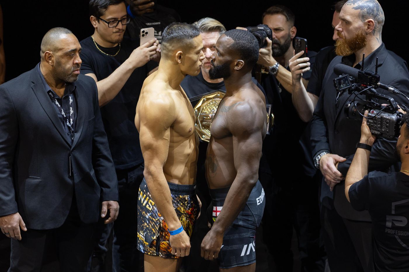 Costello in a fight-week face-off surrounded by photographers